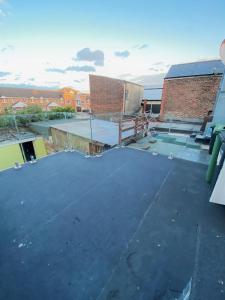 a roof that is under construction on a building at The Fratton Apartment with parking in Portsmouth