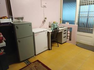 Kuchyň nebo kuchyňský kout v ubytování Ruishi Homestay