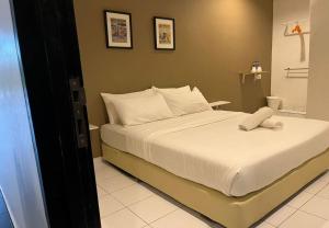 Postel nebo postele na pokoji v ubytování 1108 Hotel Sungkai