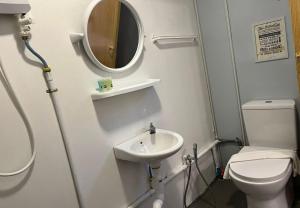 a small bathroom with a sink and a toilet at 1108 Carebin Slim River in Slim River