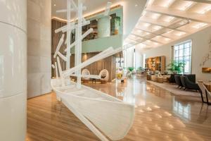 a hammock in the middle of a living room at Le Royal Meridien Beach Resort & Spa Dubai in Dubai