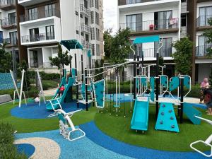 a playground in a apartment complex with a slide at Sandakan SeaView-Suite Top Floor in Sandakan
