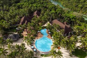 an aerial view of the pool at the resort at Le Méridien Ile des Pins in Oro Bay