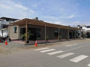 a building with orange cones in front of a street at J&B Aparment 1 Punta Hermosa in Punta Hermosa