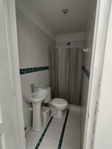 a bathroom with a toilet and a sink at J&B Aparment 1 Punta Hermosa in Punta Hermosa +31 photos