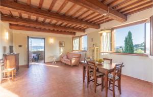 a large living room with a table and chairs at Seranna 3 in Papiano