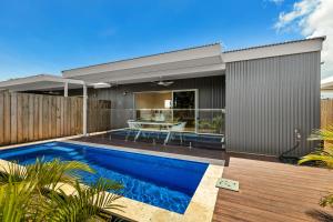 an image of a house with a swimming pool at Tiki's Pearl Villa Broome in Cable Beach