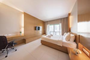 TV a/nebo společenská místnost v ubytování At 115 Hotel By Rompo