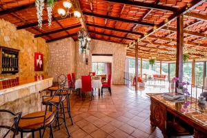 a large room with a bar and a dining room at Montana Zurqui in San José de la Montaña