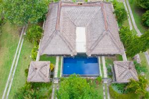 an aerial view of a house with a swimming pool at Amertha Bali Villas in Pemuteran