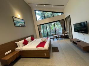Postelja oz. postelje v sobi nastanitve Coco Palms Resort, Diveagar