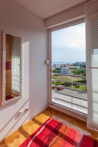 a room with a large window with a view at Apartment Skocibusic in Split