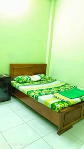 Postel nebo postele na pokoji v ubytování Nhà Nghỉ Lâm Tùng