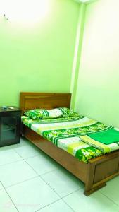 Postel nebo postele na pokoji v ubytování Nhà Nghỉ Lâm Tùng