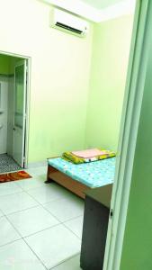 Postel nebo postele na pokoji v ubytování Nhà Nghỉ Lâm Tùng