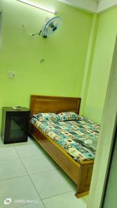 Postel nebo postele na pokoji v ubytování Nhà Nghỉ Lâm Tùng