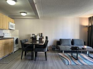 a living room with a table and a couch at Waikiki Sunset in Honolulu