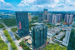 an aerial view of a city with tall buildings at Shenzhen Kingkey Kingyu Hotel in Shenzhen