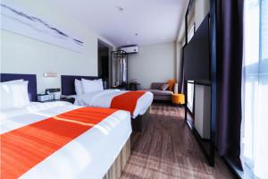 Shenzhen Kingkey Kingyu Hotelにあるベッド