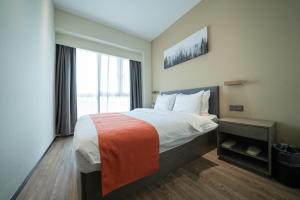 Shenzhen Kingkey Kingyu Hotelにあるベッド