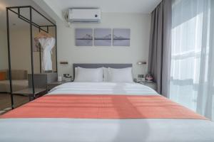 Shenzhen Kingkey Kingyu Hotelにあるベッド