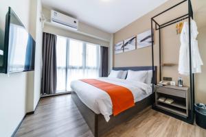 Shenzhen Kingkey Kingyu Hotelにあるベッド