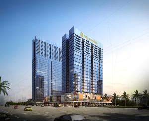 深セン市にあるShenzhen Kingkey Kingyu Hotelの上に看板がある高い建物