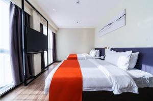 Shenzhen Kingkey Kingyu Hotelにあるベッド