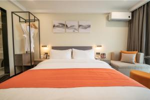 Shenzhen Kingkey Kingyu Hotelにあるベッド