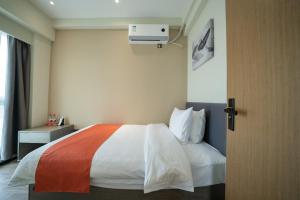 Shenzhen Kingkey Kingyu Hotelにあるベッド