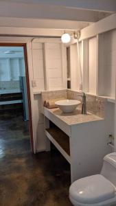 a bathroom with a sink and a toilet at Big Creek Casita in Bocas del Toro