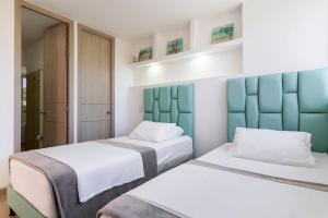 Postel nebo postele na pokoji v ubytování Apartamento Citadela Di Sole Santa Fe Antioquia + 37 fotografií