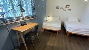 Postel nebo postele na pokoji v ubytování Cozy House Hostel