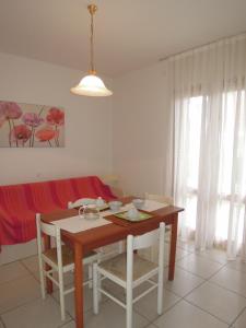 A seating area at Villa with garden close to Bibione beach - Beahost