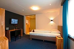 Voodi või voodid majutusasutuse HotelChur.ch toas