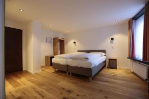 Voodi või voodid majutusasutuse HotelChur.ch toas