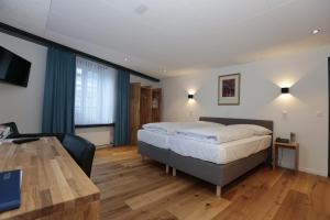 Voodi või voodid majutusasutuse HotelChur.ch toas