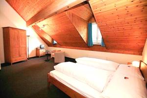 Voodi või voodid majutusasutuse HotelChur.ch toas