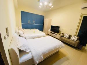 Cama ou camas em um quarto em 鸚鵡民宿