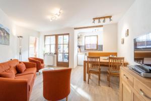 a living room with a couch and a table at Edelweiß in Bad Hindelang