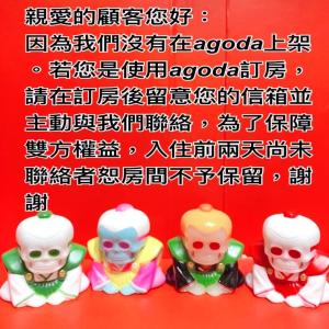 a group of four toy figurines in front of a sign at 逢甲 Toy RooM in Taichung