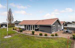 a house with a red roof at 4 Bedroom Awesome Home In Egernsund in Egernsund +16 photos