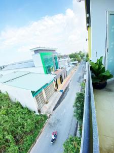 a view of a street from a balcony of a building at Ngoc Kha Tu 1 Hotel in Long Xuyên