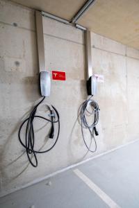 two wires are hooked up to a wall at sHome Hotel Graz - Self-Check-in & free parking in Graz