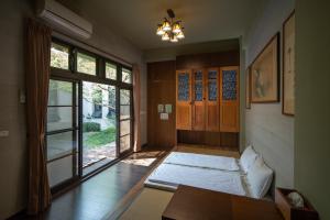 מיטה או מיטות בחדר ב-Amrita Green Retreat