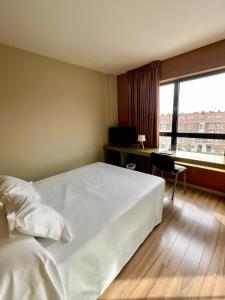 Postel nebo postele na pokoji v ubytování Hotel Duero
