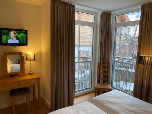 Łóżko lub łóżka w pokoju w obiekcie Villa Augustine In Hinterglemm Zentrum