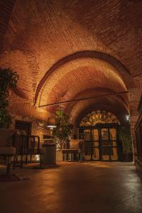 a room with a brick wall and a vaulted ceiling at Han 1772 Hotel in Istanbul