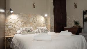 Llit o llits en una habitació de Angolo Dei Priori - city center-