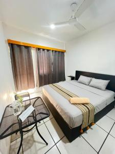 a bedroom with a bed and a chair in it at Private room with king size bed in Puerto Escondido